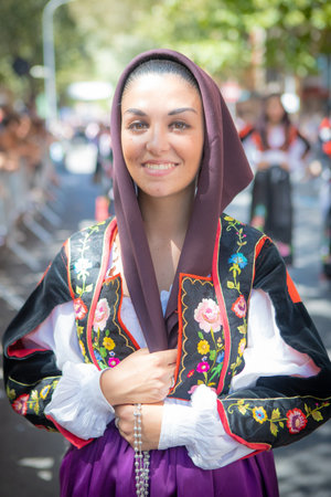 NUORO, ITALY - 2017 JULY 16 - traditional Sardinian dress worn by beautiful girlsのeditorial素材
