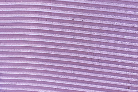 Textured surface with vertical lines and soft shadows, abstract architectural backgroundの写真素材