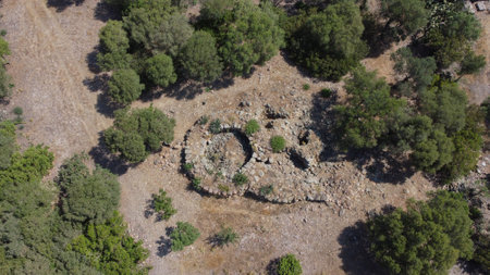 Ancient stone Nuraghe ruins surrounded by nature in southern Sardiniaの写真素材