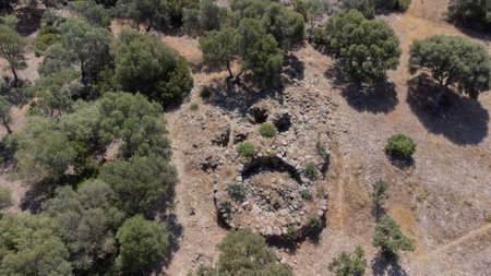 Ancient stone Nuraghe ruins surrounded by nature in southern Sardiniaの写真素材