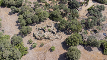 Ancient stone Nuraghe ruins surrounded by nature in southern Sardiniaの写真素材