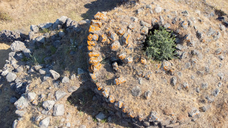 Drone shot of ancient five-lobed nuraghe ruins, Sardinia's prehistoric stone architectureの写真素材
