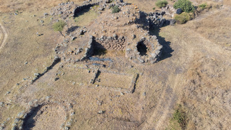 Drone shot of ancient five-lobed nuraghe ruins, Sardinia's prehistoric stone architectureの写真素材