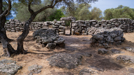 Remains of prehistoric stone huts in the Nuragic village of Serra Orrios, Sardiniaの写真素材