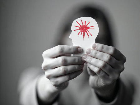 Human head cutout with virus symbol representing mental health impactの素材