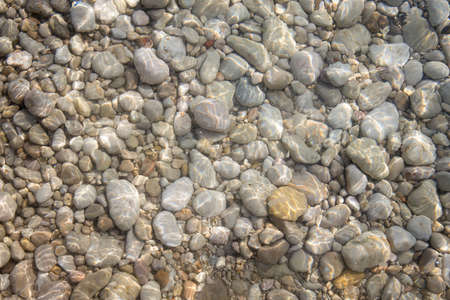Stones on the beach on spanish coast city, Alcanar, Tarragona, Spain