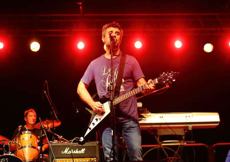 Genoa Italy - July 17 2020: A guitarist of the musical group A Ghost Notes performs on the stage of Villa Bombrini during a rock concert.のeditorial素材
