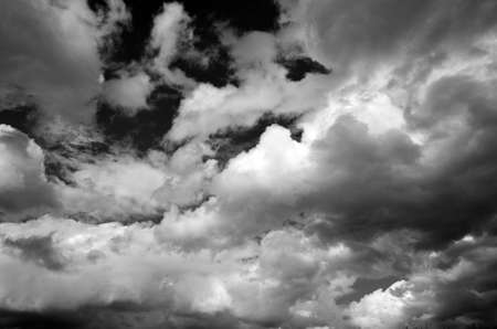 Lot of white clouds on blue sky background, black and whiteの写真素材