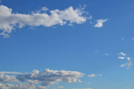 Background made of large part of clear, blue sky and some white clouds