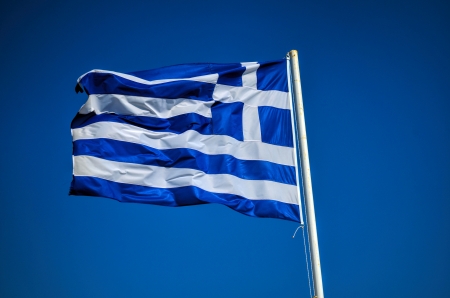Greek flag against blue sky background