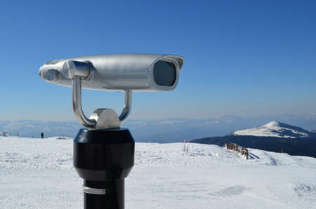 Spyglass in snowy surrounding, on the peak of mountain, ski resort on Kopaonik, Serbiaの写真素材