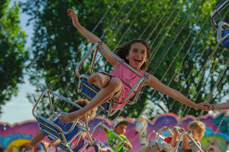 Yearly fair in Ouchy Lausanne. Children are happy in the carouselのeditorial素材