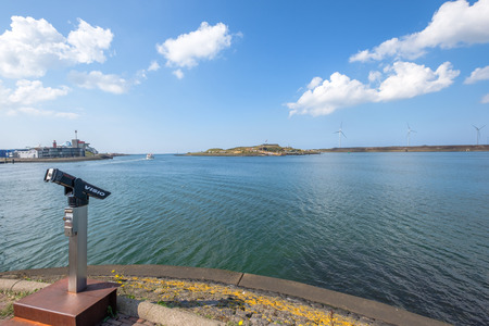 Lookout station for a view over the port of IJmuiden, The Netherlands. Wind turbines at the coast line.のeditorial素材
