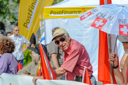Elderly supporter and spectators near the finish line of the World Orienteering Championships in Lausanne, Switzerland.のeditorial素材