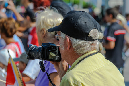 Elderly supporter and spectators near the finish line of the World Orienteering Championships in Lausanne, Switzerland.のeditorial素材
