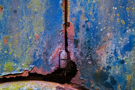 Colorful textured natural painting, rusted and weathered surface of an old antique truck that has stood in the open air for yearsの写真素材