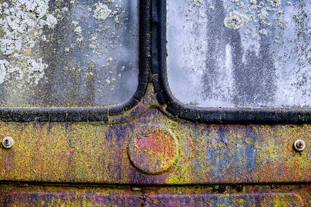 Colorful textured natural painting, rusted and weathered surface of an old antique truck that has stood in the open air for yearsの写真素材