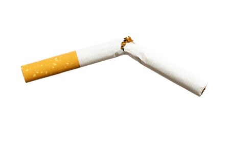 Frontal close up of broken cigarette isolated on white backgroundの写真素材