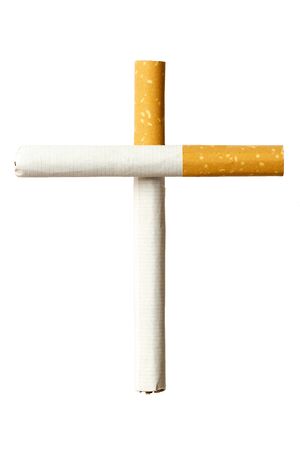 Frontal close up of two cigarettes forming a tomb cross isolated on a white background, a smokers graveyard conceptの写真素材