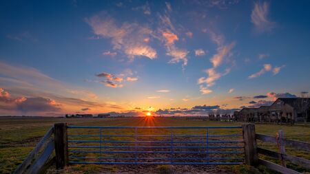 Sunset in Midden-Delfland, the area between The Hague and Rotterdam in the Netherlands.の写真素材