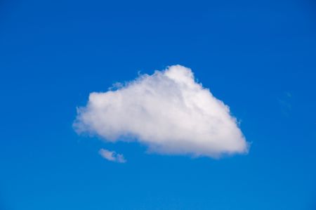 A solitary cloud in blu skyの写真素材