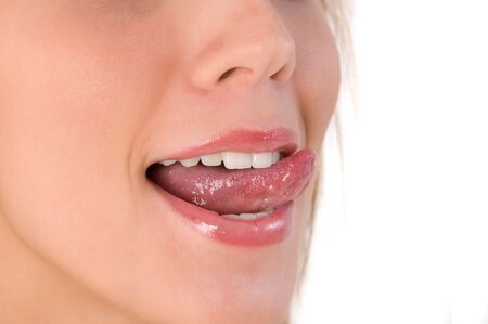 Beautiful woman leaking teeth with tongue close-up