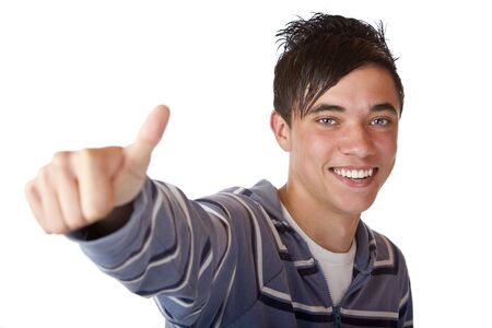 Closeup of nice and  charming student expressing  happiness by showing thumb up. Isolated on white.の写真素材