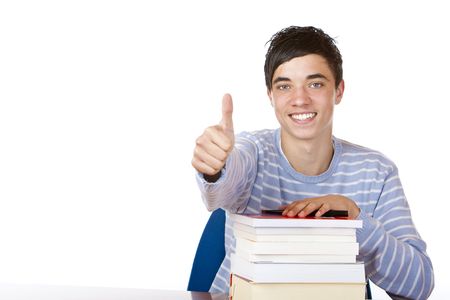 Young happy male student is smiling and leaning on his study books. Isolated on white.の写真素材