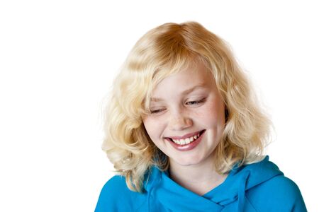 Young beautiful girl / child smiles happy into camera. Isolated on white background.の写真素材