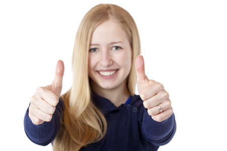 Young beautiful smiling woman shows both thumbs up. Isolated on white.