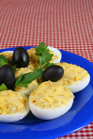 Stuffed eggs on a plate on a tableの写真素材