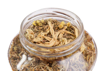 Camomile herbal tea in glass bottleの写真素材