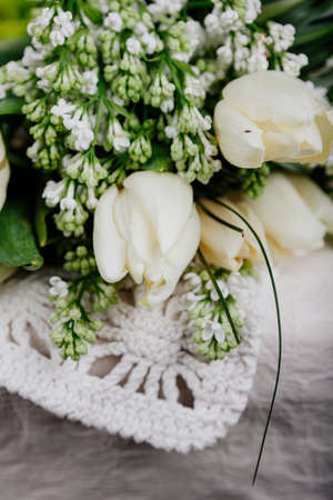 Bouquet of white tulips with lilacの写真素材