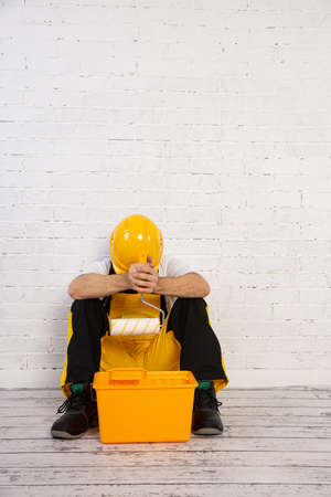 Sometimes fatigue forces you to rest during painting. Physical work still requires good physical condition.の写真素材