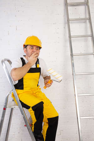 A big problem to solve during painting. Despite physical work, thinking is essential to doing the right job.の写真素材