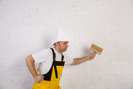 A professional painter compact and ready to work at any time. He is wearing typical protective...