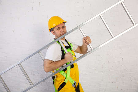 A professional builder with a ladder, compact and ready to work at any time.