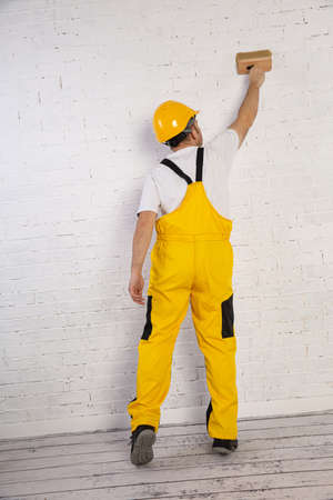 Painting the entire wall with a thick brush or paint roller.