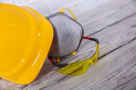 A protective helmet and dust mask is necessary for any construction work. A protective helmet,...