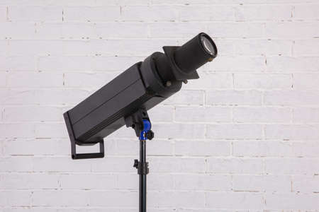 A studio flash fires a lot of light at a time when shooting.