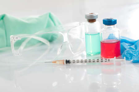 Glasses and a protective mask increase work safety during various experiments in the laboratory of infectious diseases.の写真素材