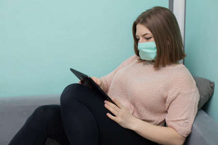 In the academic room you must be in a face mask to reduce the risk of infection.の写真素材