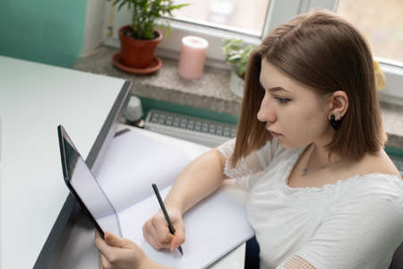 Learning with a tablet in your hand is very nice and pleasant when all the information is in one place.の写真素材