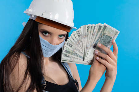 At the present time, when paying your salary, you must remember at least the protective mask.の写真素材