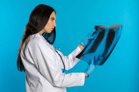 The pulmonologist checks the patient's lungs for any disturbing changes.