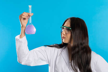 In the glass laboratory vial there is the beginning of a medicine for an infectious disease.の写真素材