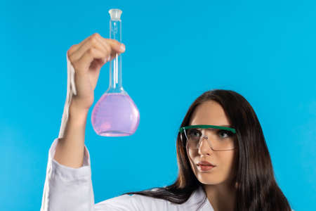 In the glass laboratory vial there is the beginning of a medicine for an infectious disease.の写真素材