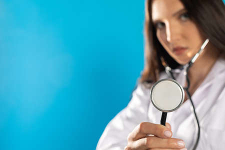 Stethoscope examination by a young lady at a pneumonology outpatient clinic.の写真素材