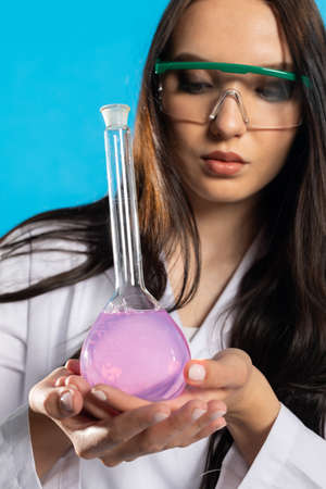 In the glass laboratory vial there is the beginning of a medicine for an infectious disease.の写真素材