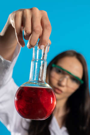 A young woman developed a base for a drug for COVID-19.の写真素材